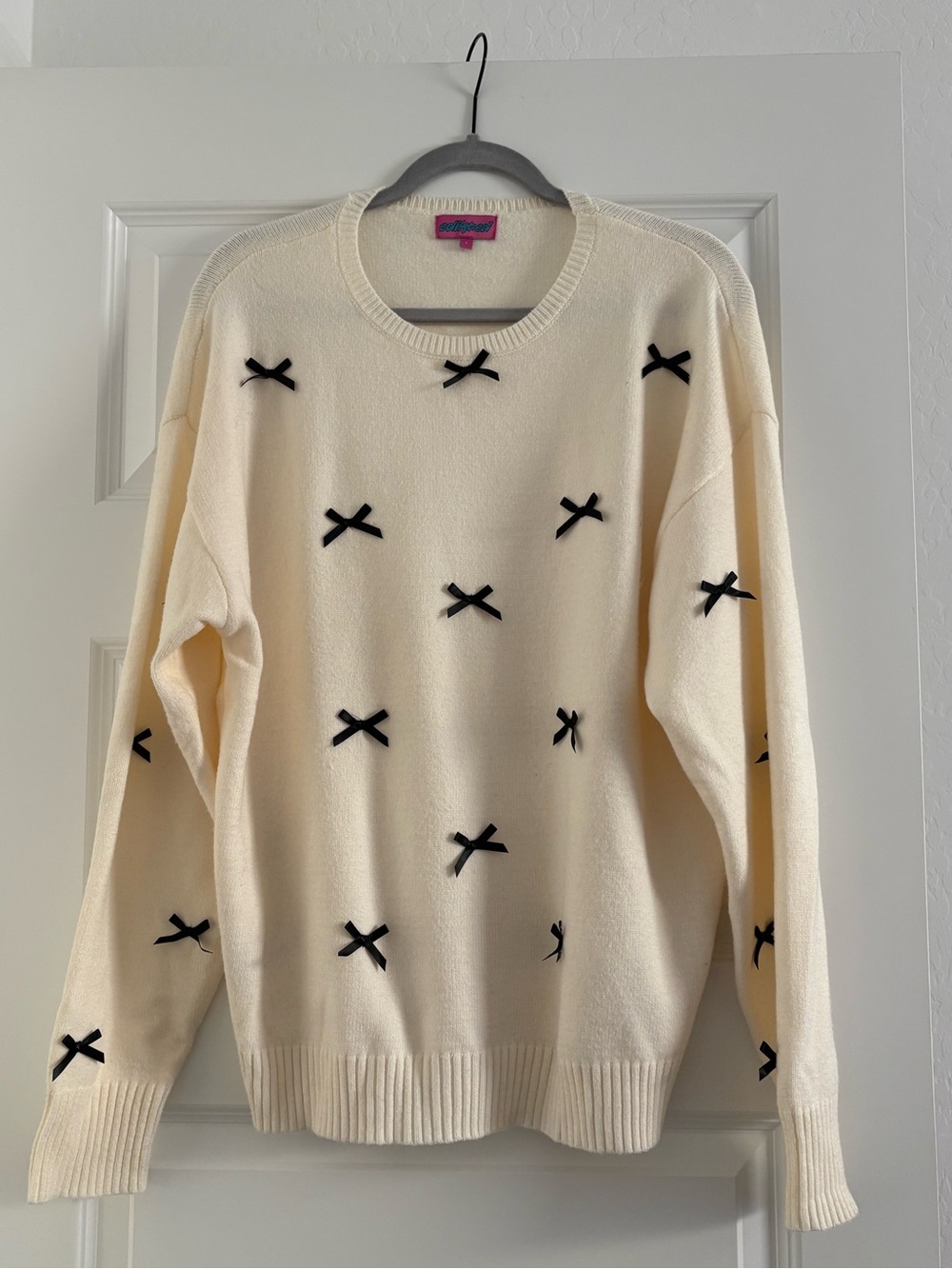 Edikted Cream Crewneck Sweater with Black Bow Appliqués